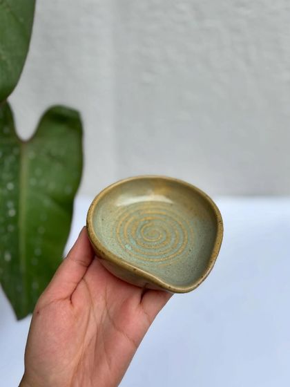 This spoon rest is in our Chun glaze, a lovely speckled blue-green.