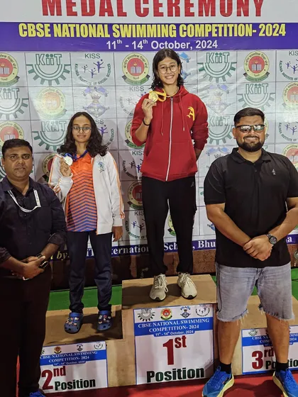 Prapti Ghose on the top of the podium at the CBSE National Swimming Competition. Winning gold in the 50m breaststroke is a direct result of our focused, technique-driven training clinics.