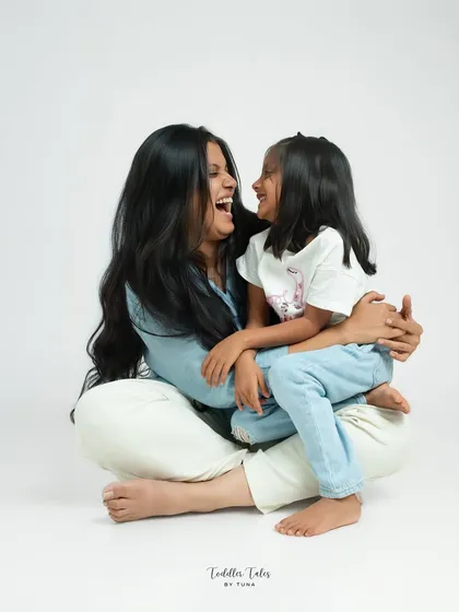 A moment of shared laughter between a mother and her daughter. My studio sessions are designed to capture this genuine connection, creating portraits that radiate love and happiness.