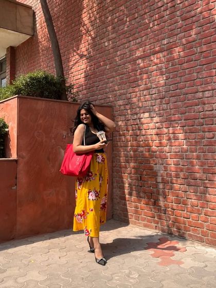 I added a bright red tote bag to this look, showing how a pop of contrasting color can add an extra bit of fun and personality to your outfit.