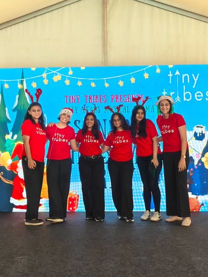 Our team in festive reindeer antlers, posing on stage after our "Santa's Christmas Crew" musical at the Kukdukoo Fest. We were so excited to bring our improv style performance to this wonderful event.