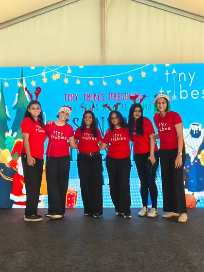 Our team in festive reindeer antlers, posing on stage after our "Santa's Christmas Crew" musical at the Kukdukoo Fest. We were so excited to bring our improv style performance to this wonderful event.