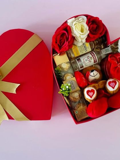 A classic heart-shaped box for Valentine's Day. This one is curated for him, with miniature liquor bottles, Ferrero Rocher, and a teddy bear.