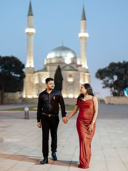 An evening stroll in Baku, with a beautifully lit mosque in the background. This shot captures a quiet, romantic moment against a backdrop of cultural beauty.
