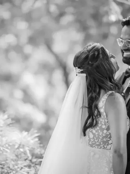 A beautiful black and white candid of the couple sharing a laugh. These are the moments that truly capture the joy of a wedding day.