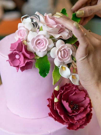 A close-up of the handcrafted sugar flowers on our 40kg cake. Each petal is carefully shaped and placed to create a lifelike and beautiful floral arrangement.