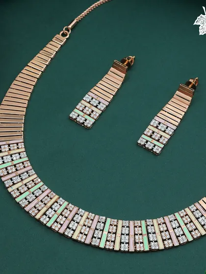 The full Fusion Rose Gold necklace and earring set, a testament to contemporary craftsmanship.