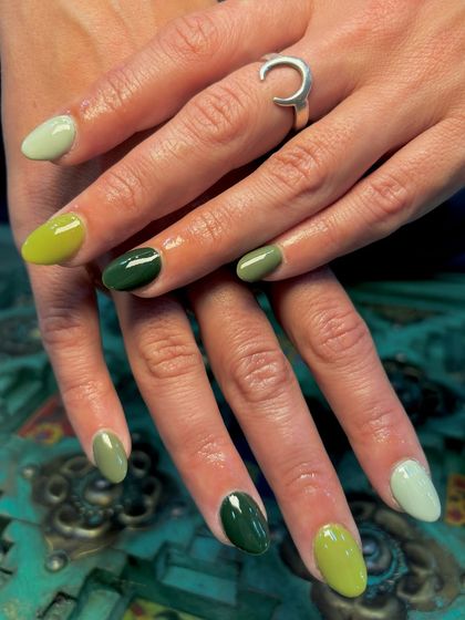 A spectrum of green perfection. For the client who couldn't choose just one shade, we did a different shade of green on each nail, from mint to olive to deep forest green.