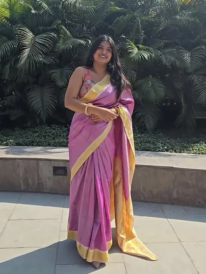 This look is personal. I styled my mom's beautiful Kanjivaram saree for a day at college. It shows how you can take a sentimental piece and wear it in a way that feels young, fresh, and completely you, complete with the perfect jhumkas.