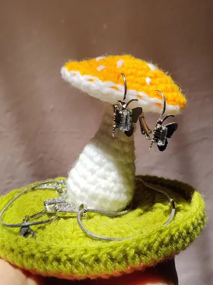 The yellow mushroom jewelry holder captured in beautiful sunlight.