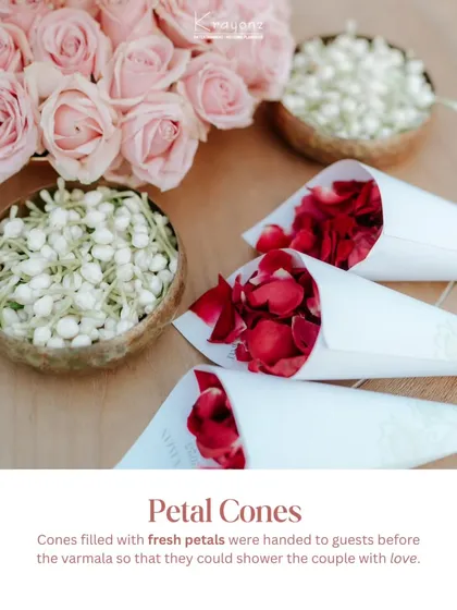 Cones filled with fresh rose petals were handed to guests before the varmala, so they could shower the couple with love and blessings at the perfect moment.