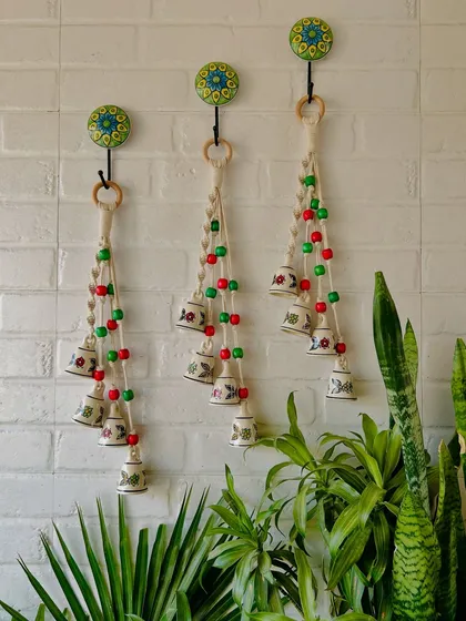 Our 2024 Christmas Collection is here. This image displays our festive bell decorations, handmade with small and big ceramic bells and colorful wooden beads, perfect for adding a touch of holiday cheer.