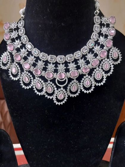 A beautiful American Diamond necklace set with light pink stones, ideal for a modern and feminine look.