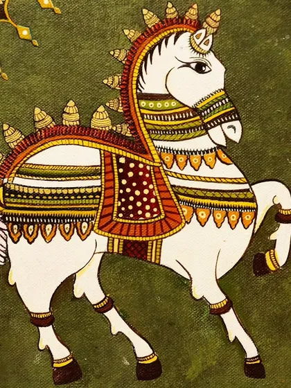 A traditionally decorated horse painted in a classic Indian folk style, showcasing rich colors and intricate patterns.