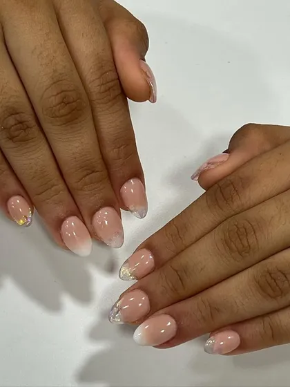 A classic baby boomer or French ombre design on almond-shaped acrylic extensions. I added a touch of fine glitter for a subtle, sparkling finish.