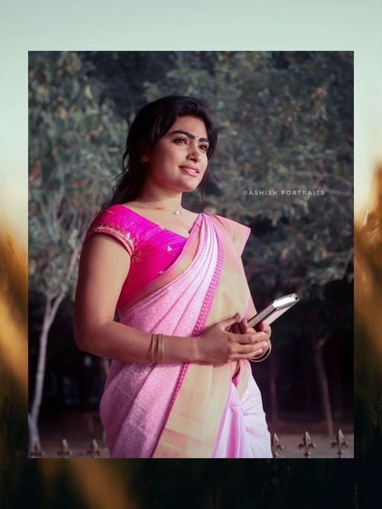 A thoughtful pose from the pink saree photoshoot. The makeup is soft and enhances the natural features, suitable for a variety of creative concepts.