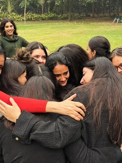 Ubuntu is a core value at Children First, representing our interconnectedness. Here, our team celebrates a colleague's 10-year work anniversary with a group hug, showcasing the warmth and friendship that defines our community.