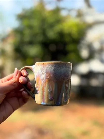 We love experimenting with glazes, and this mug is a perfect example. A beautiful pastel Chun glaze with a running Rutile rim creates these gorgeous, drippy effects that make each mug truly one of a kind.