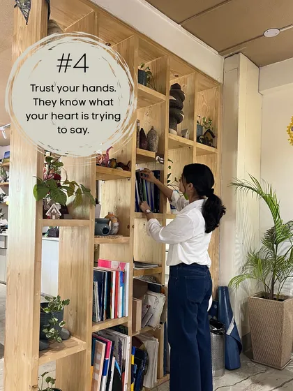 Trust your hands. They know what your heart is trying to say. Me, exploring the shelves at a creative studio, feeling inspired.