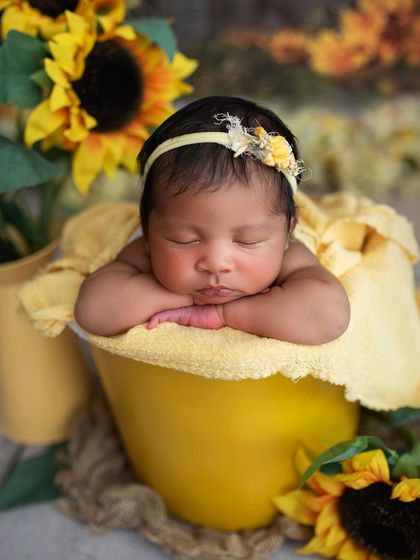 A close-up on this little sunflower baby. The yellow tones make her skin look so warm and glowing.