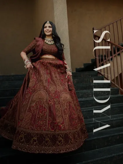 A powerful and stylish bridal portrait, with the bride standing confidently on a staircase.
