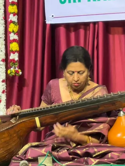A close-up of me, completely absorbed in the music. This is my world, where every note from the veena tells a story.