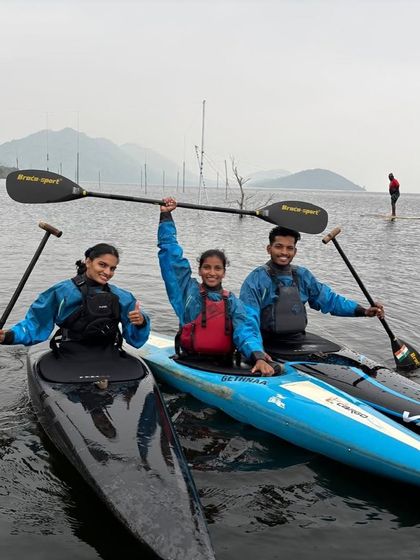 Our competitive kayaking team, all smiles and ready to train. Here they are in their high-performance kayaks, preparing for the upcoming nationals.