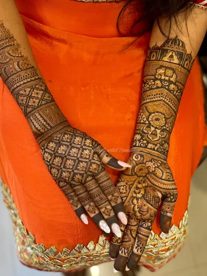This design combines a modern grid pattern on one hand with a traditional architectural (jharokha) motif on the other, creating a unique bridal look.