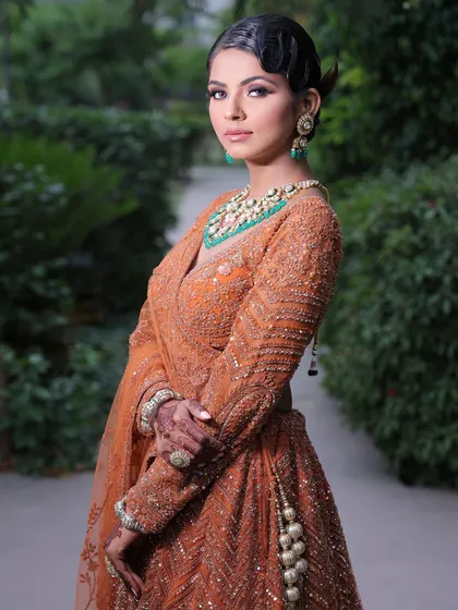 My styling services extend beyond the wedding day to any special event. This elegant party look features soft, glamorous makeup and a chic hairstyle, perfect for a sangeet, reception, or any celebration.