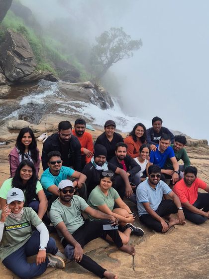 A group photo at the top of Bandaje Falls, a memory of a great adventure.