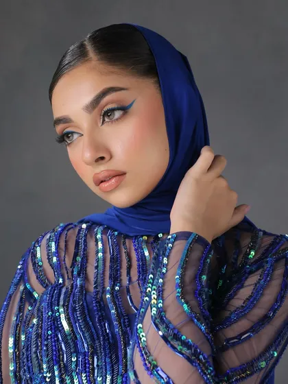 A close-up showing the precision of the blue winged liner. This is a great example of how a simple pop of colour can elevate a whole look.