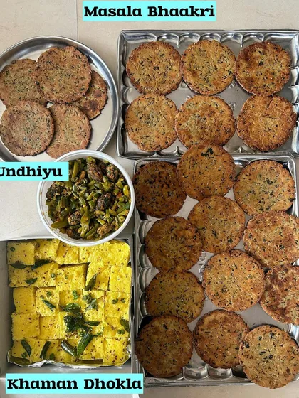 A combination of savory snacks: Masala Bhaakri, Undhiyu, and Khaman Dhokla.