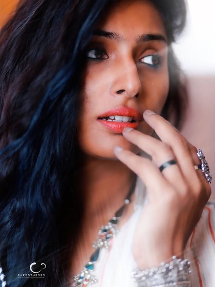 A close-up that feels like a secret being whispered. The soft focus and high-key lighting create a dreamy, intimate portrait that is full of gentle emotion.