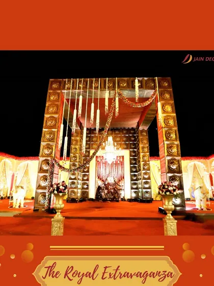 The "Royal Extravaganza" entrance. This grand structure is adorned with traditional motifs and hanging tassels, creating a majestic and unforgettable welcome for a regal wedding.