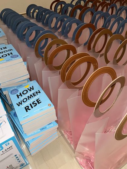 A throwback to a recent Women's Day corporate celebration. We curated hundreds of these gift bags, each containing the book "How Women Rise" and other items.