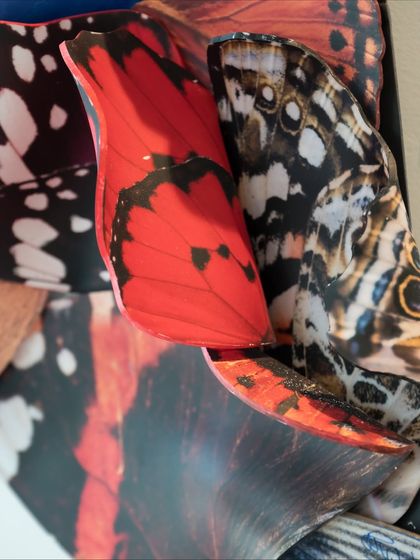 Another detail from "A Symphony of Wings," showing the layered and folded forms that give the piece its texture and depth.