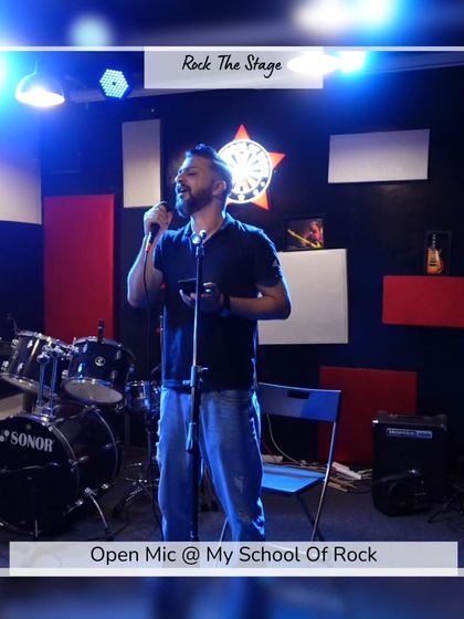 A comedian mid-joke, engaging with the audience. Our open mic is a great place for comedians to test new material in front of a friendly crowd.