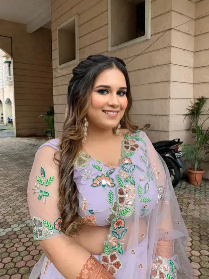 A beautiful shot of the Roka bride, her makeup perfectly complementing her pastel floral lehenga.