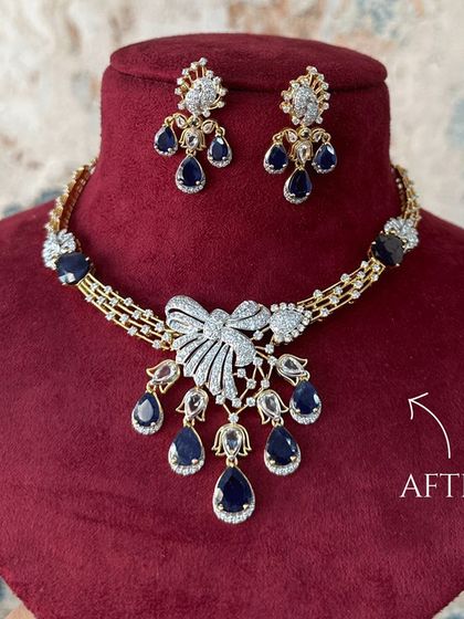 The stunning "After" of a diamond necklace transformation. The addition of deep blue sapphires and rose-cut diamonds gives this piece a completely new, luxurious, and modern feel.
