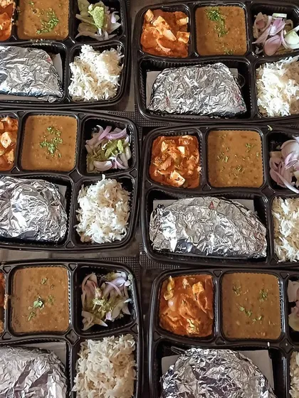 A set of thalis with Dal Tadka and Kadai Paneer, ready for a party. I can cater to events of all sizes.
