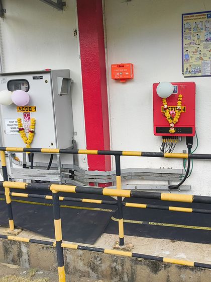 The decorated inverter setup at the inauguration of the HCCB solar plant. We celebrate every milestone with our clients, marking our shared commitment to a greener future.