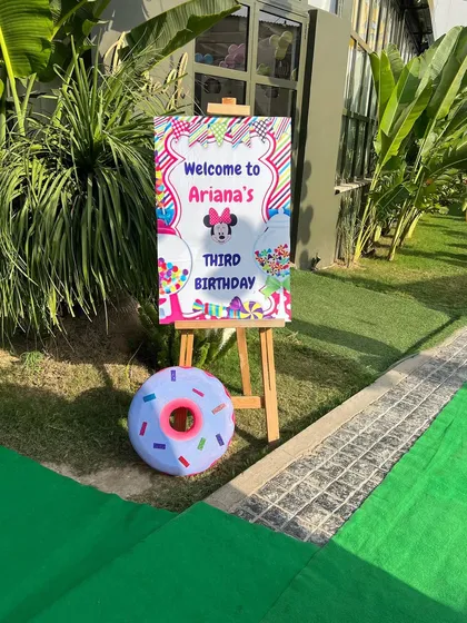 A personalized welcome sign for Ariana's Candyland third birthday party.