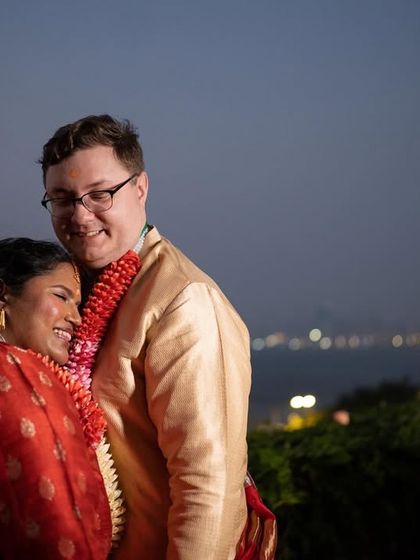 A happy, candid moment of the couple enjoying their time together, overlooking the sea in Mumbai.