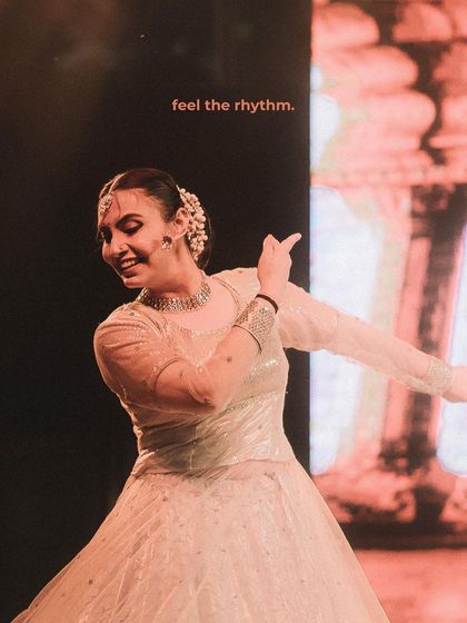 A dancer is captured in a moment of pure joy, with the words "feel the rhythm" overlaid. This is an example of my creative editing style, adding another layer of storytelling to the image.