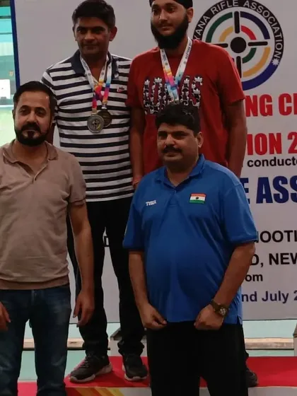 Awarding medals to the men's category winners. It was an honor to be invited by the Haryana State Rifle Association to officiate the event.