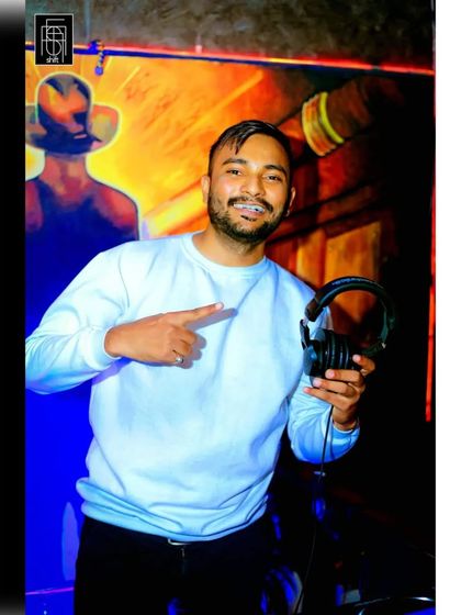 My job is to spread happiness through my work. Holding up my headphones, ready to share the music and make people happy.