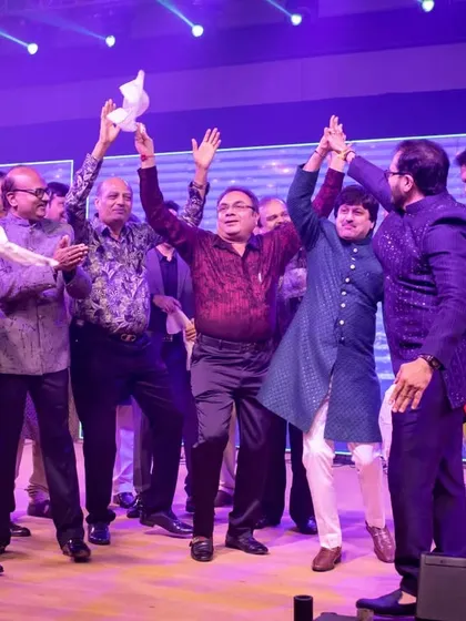 The entire family joins in the celebration on stage. Sangeet is all about bringing everyone together for a night of fun and performances.