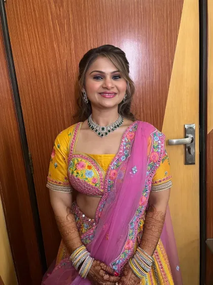 A smiling portrait of the client, looking radiant and happy.