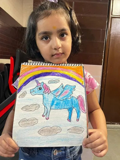 A magical unicorn complete with a rainbow, created by one of my talented students. My classes encourage kids to explore their imagination and bring fantasy worlds to life.