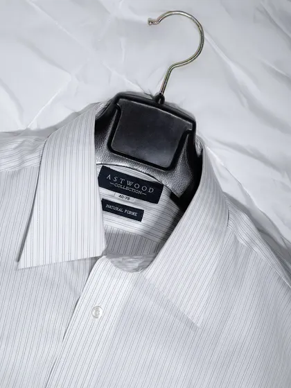 A flat-lay shot of a formal Astwood shirt on a white background. This simple, clean presentation is effective for showcasing apparel details online.
